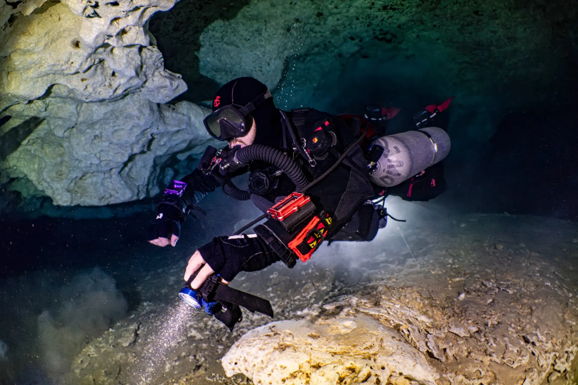 Closed-circuit rebreather diver in a cave