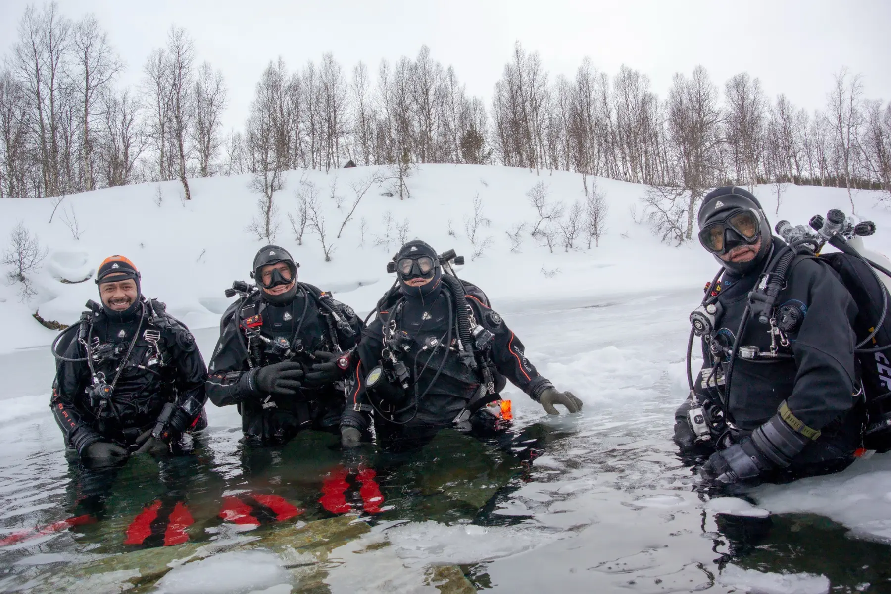 Expedition divers in icy water